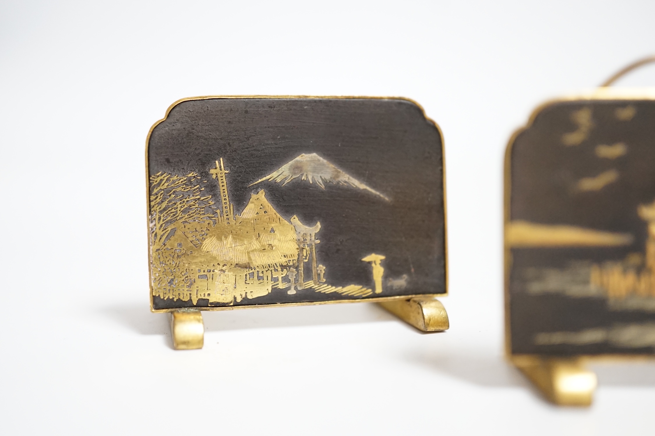 Three Japanese gold damascened iron menu holders by S. Komai, in original box, each 5cm wide